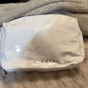 Riddle Travel Bag, an accessory from the fragrance and skincare brand Riddle Oil